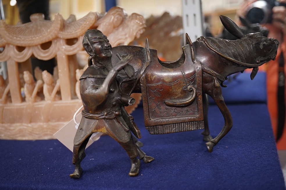 A Japanese bronze dragon vase, Chinese bronze immortal on donkey, and soapstone dragon boat carving, bronze vase 24cm high. Condition - good